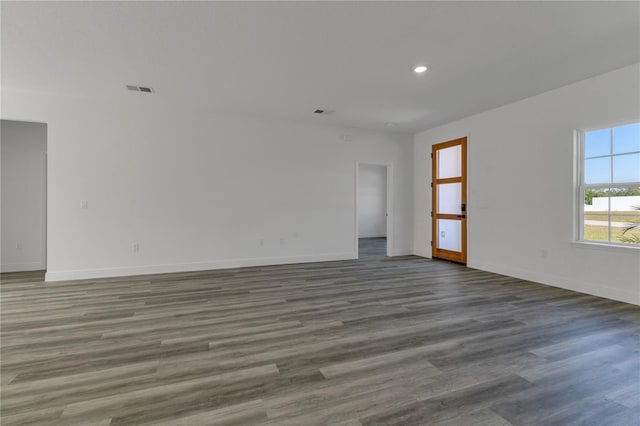 unfurnished room with dark hardwood / wood-style floors