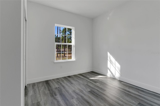 unfurnished room with hardwood / wood-style floors