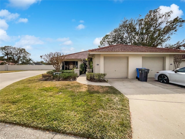 view of front of house featuring a garage and a front yard