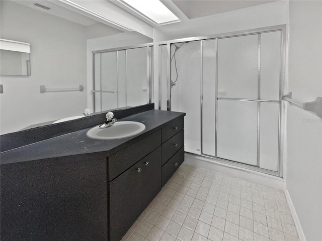 bathroom with vanity and an enclosed shower