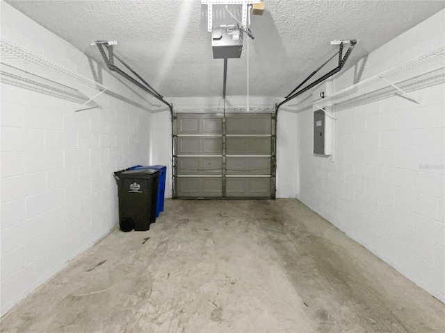 garage featuring a garage door opener and electric panel