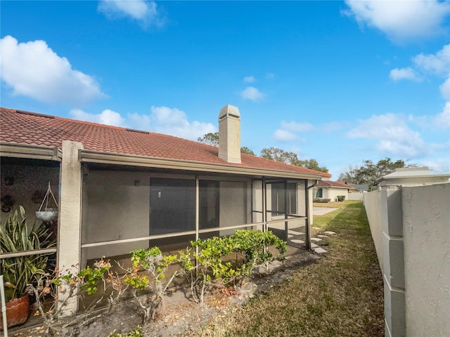 rear view of house with a sunroom