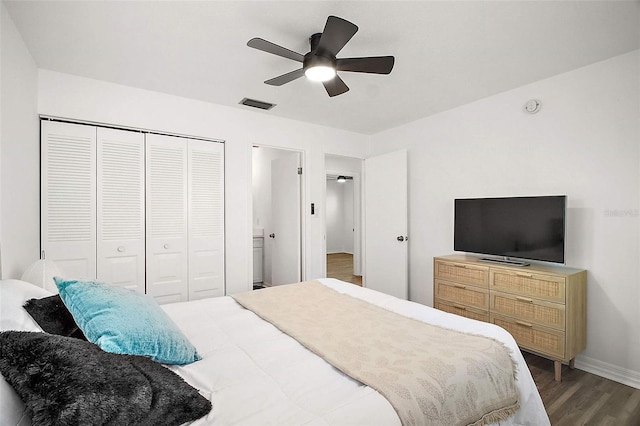 bedroom featuring hardwood / wood-style floors, a closet, and ceiling fan