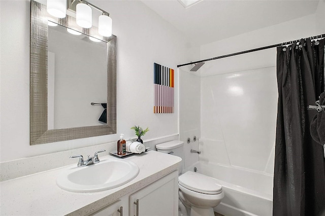 full bathroom featuring vanity, shower / bath combination with curtain, and toilet