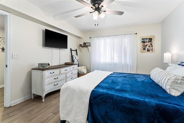 bedroom featuring ceiling fan and light wood-type flooring