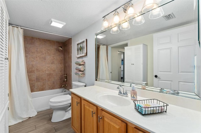 full bathroom with toilet, a textured ceiling, vanity, shower / bath combination with curtain, and hardwood / wood-style floors