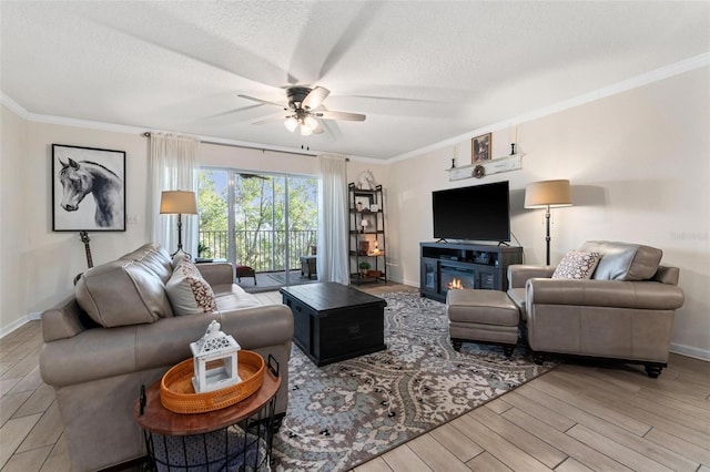 living room with crown molding, ceiling fan, a textured ceiling, and light hardwood / wood-style flooring