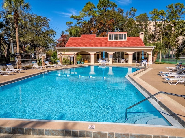 view of swimming pool featuring a patio area