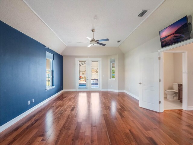 interior space featuring french doors, ceiling fan, lofted ceiling, and hardwood / wood-style floors