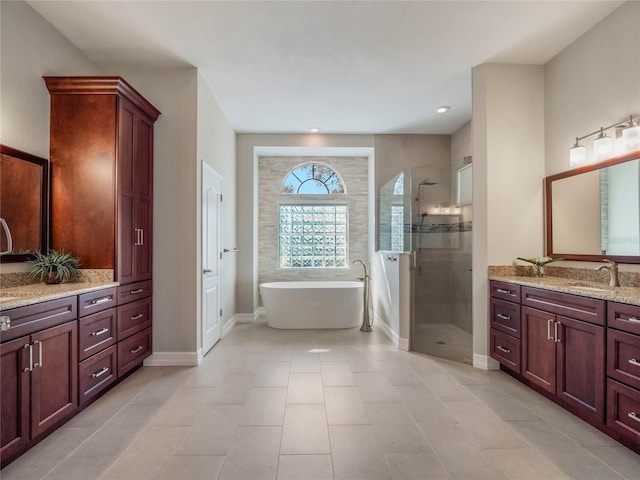 bathroom featuring vanity and independent shower and bath