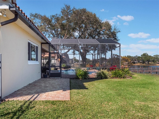 view of yard with a lanai and a patio area