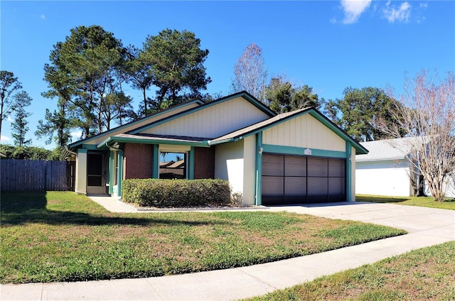 ranch-style home featuring a garage and a front lawn