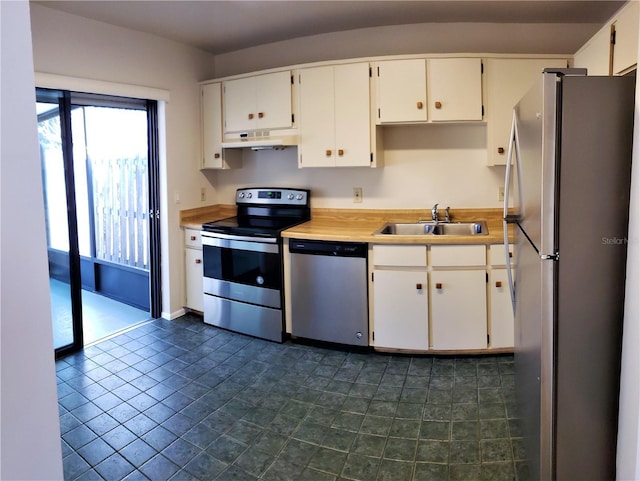 kitchen with white cabinetry, stainless steel appliances, and sink