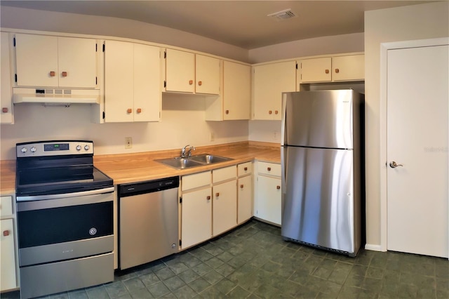 kitchen featuring white cabinetry, appliances with stainless steel finishes, and sink