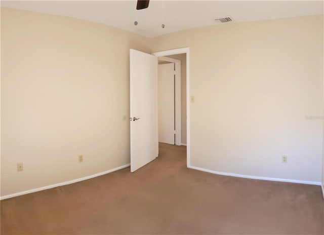 unfurnished room with carpet floors and ceiling fan