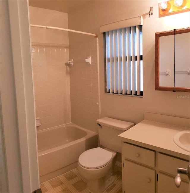 full bathroom featuring vanity, toilet, and tiled shower / bath combo