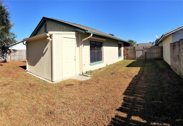 rear view of house with a yard