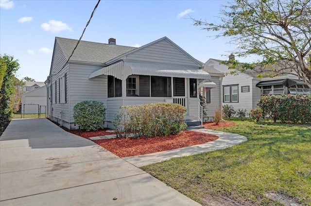 bungalow-style house with a front yard