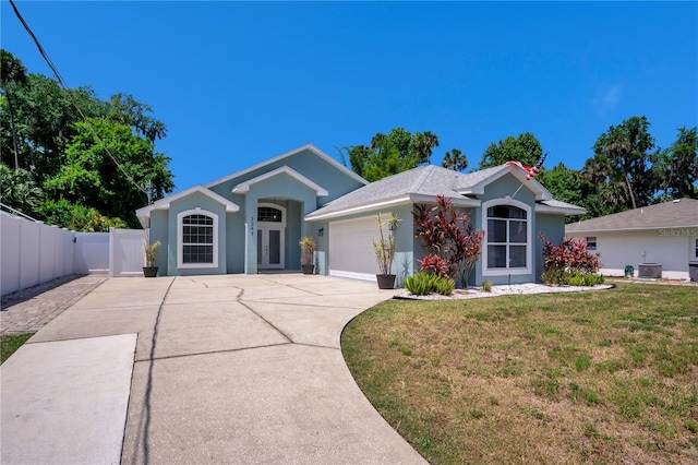 ranch-style house with a garage and a front yard