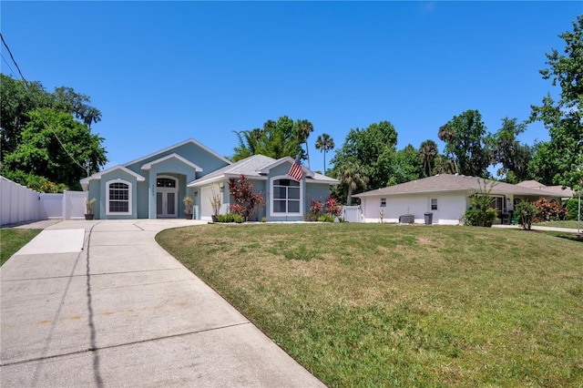 single story home with a front yard