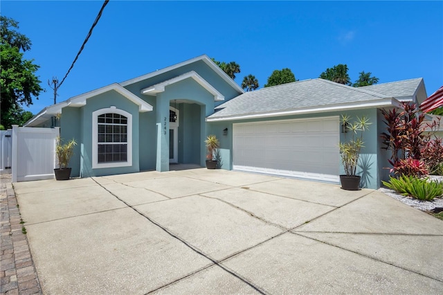 single story home featuring a garage