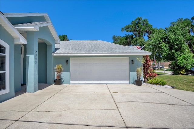 view of side of home featuring a garage