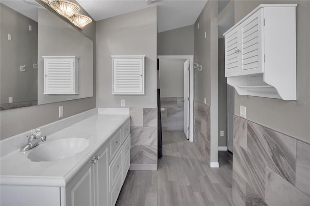 bathroom featuring hardwood / wood-style flooring and vanity