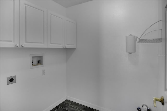 washroom featuring cabinets, hookup for a washing machine, and electric dryer hookup