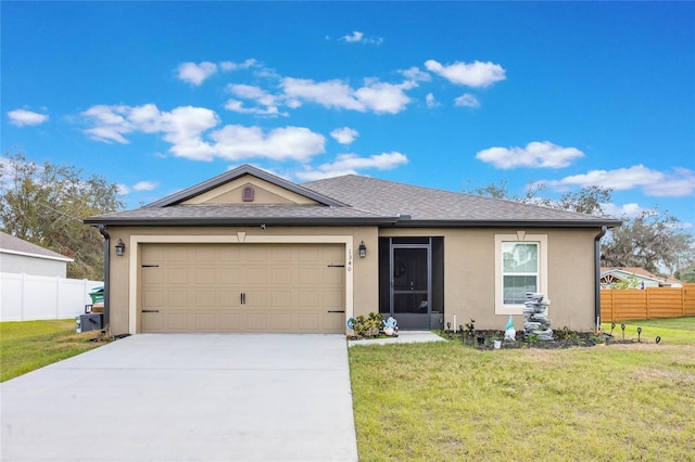 ranch-style home featuring a garage and a front yard