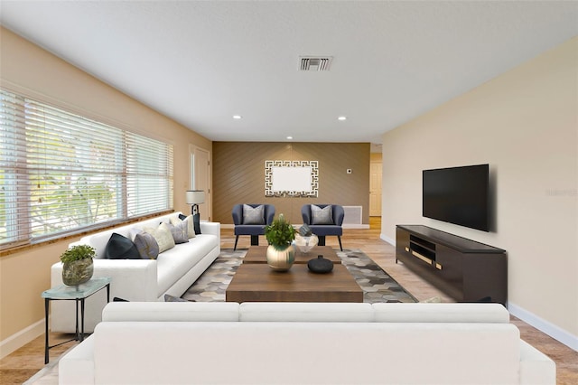 living room with wood walls