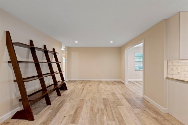 spare room featuring light hardwood / wood-style floors