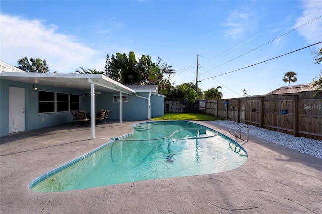 view of swimming pool with a patio area