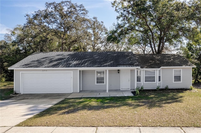 single story home featuring concrete driveway, a front lawn, an attached garage, and a shingled roof