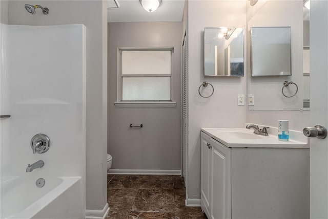 bathroom featuring toilet, bathtub / shower combination, baseboards, and vanity