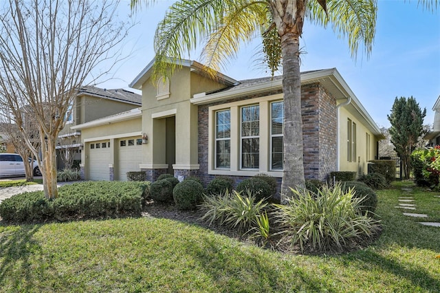 view of front facade featuring a garage and a front lawn