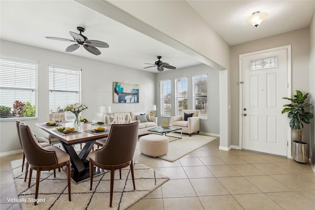 tiled dining area featuring ceiling fan