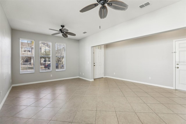 unfurnished room featuring light tile patterned floors and ceiling fan