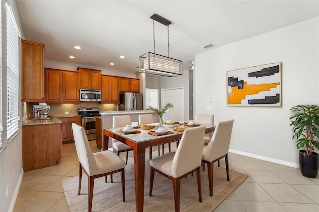 dining room featuring light tile patterned floors