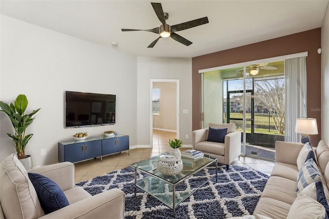 living room featuring light tile patterned floors and ceiling fan