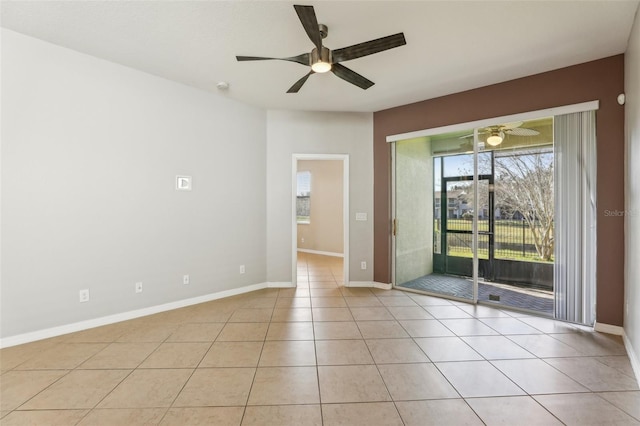 unfurnished room featuring light tile patterned floors and ceiling fan