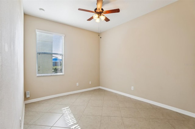 empty room with light tile patterned floors and ceiling fan