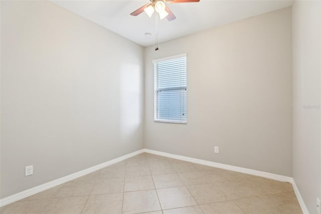 spare room featuring ceiling fan and light tile patterned floors