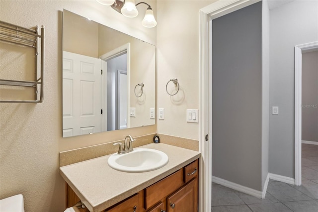 bathroom with tile patterned floors and vanity