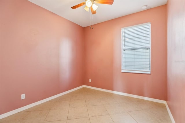 tiled empty room with ceiling fan