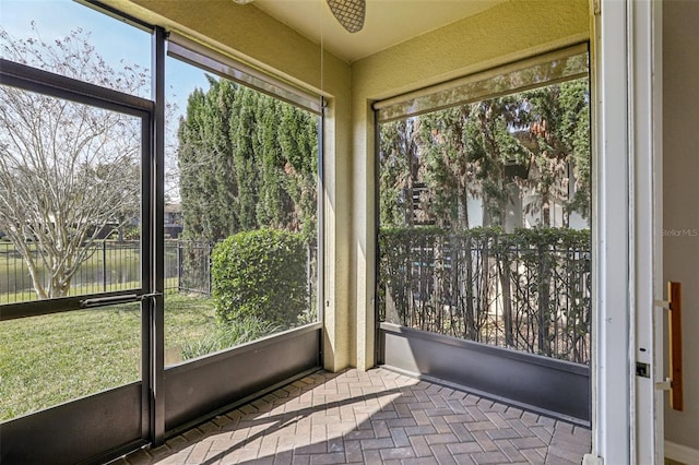 unfurnished sunroom with a water view