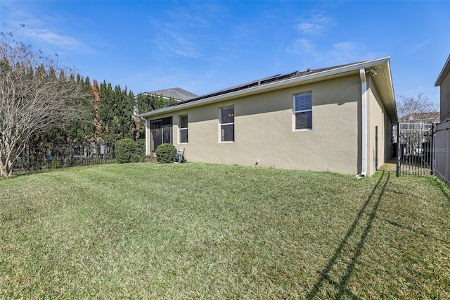 rear view of house with a yard