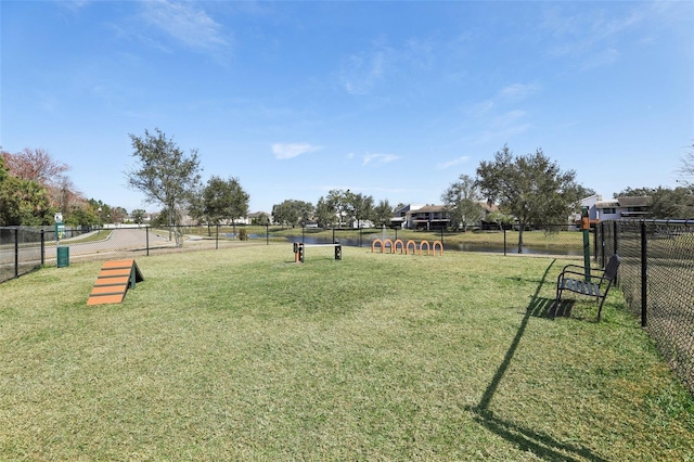 view of property's community with a yard