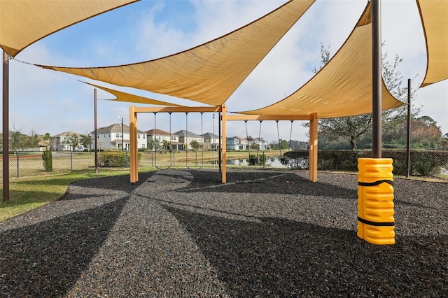 view of community featuring a water view and a playground