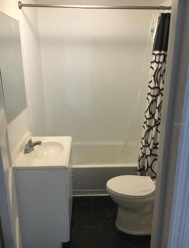 full bathroom featuring vanity, toilet, and shower / bath combo with shower curtain