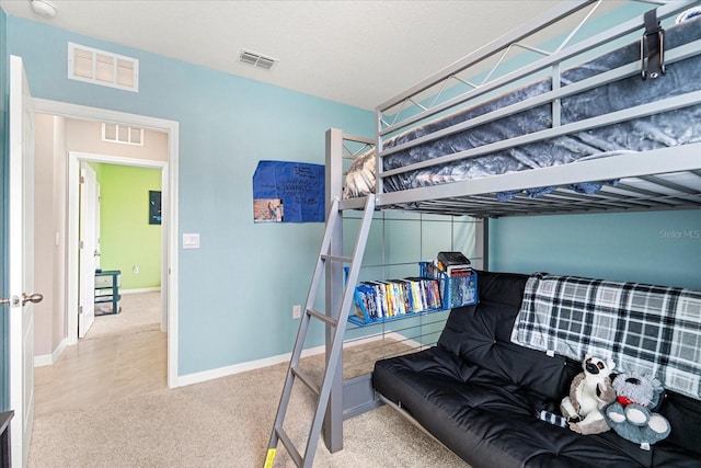 bedroom with carpet, visible vents, and baseboards